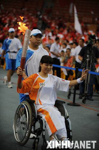 Wen Qing, who was crowned as 'wheelchair princess' was the last torchbearer in Beijing Paralympic Torch Relay Wuhan leg on Sunday. 