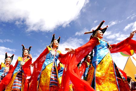 People perform at the opening ceremony of the Shoton (Yogurt) Festival celebration in on the Potala Palace Square in Lhasa, capital of Tibet Autonomous Regional, August 30, 2008. Various activities will be held during the Shoton Festival such as Tangka Paintings display, dancings and Tibetan drama show etc. 