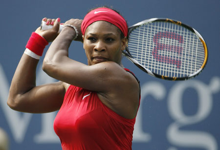 Serena Williams of the United States hits a return shot to Ai Sugiyama of Japan during their match at the U.S. Open tennis tournament in Flushing Meadows in New York, August 30, 2008.
