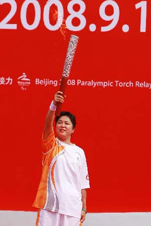 The Paralympic torch was relayed on Monday in Shanghai, the third stop of the flame's 'modern China' route. [Xinhua] 