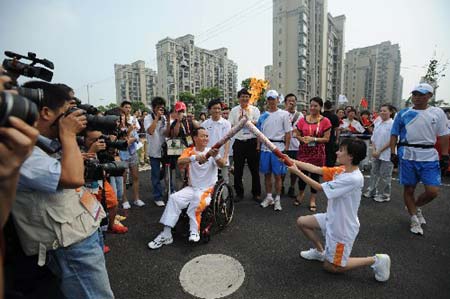 The Paralympic torch was relayed on Monday in Shanghai, the third stop of the flame's 'modern China' route. [Xinhua] 