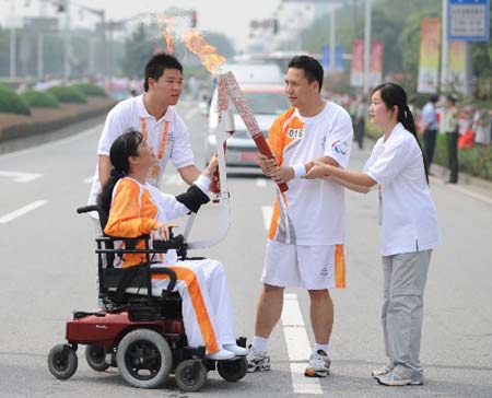 The Paralympic torch was relayed on Monday in Shanghai, the third stop of the flame's 'modern China' route. [Xinhua] 