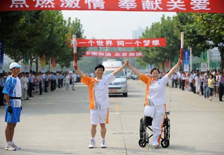 The Paralympic torch was relayed on Monday in Shanghai, the third stop of the flame's 'modern China' route. [Xinhua] 