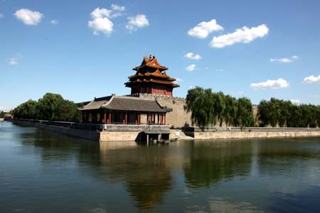 A corner tower on the rampart surrounding the ancient Forbidden City is reflected in the moat in central Beijing, China, Aug. 31, 2008. Beijing saw an extra bright sunshine on Sunday.