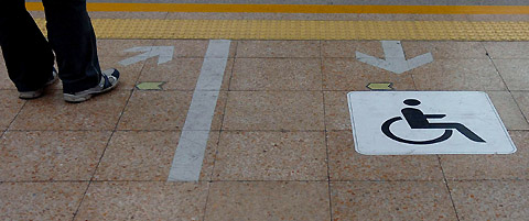 A sign signals a subway carriage giving priority to wheelchair-users at Xidan subway station, August 28, 2008. Accessible facilities for the upcoming Paralympics have been put in place in Beijing.[Xinhua]