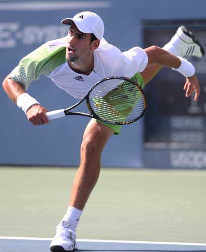Novak Djokovic of Serbia serves against Tommy Robredo of Spain during Day 9 of the 2008 U.S. Open at the USTA Billie Jean King National Tennis Center on September 2, 2008 in the Flushing neighborhood of the Queens borough of New York City. 