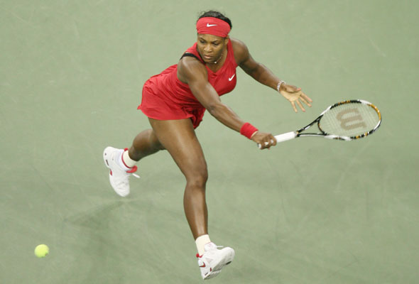 Serena Williams of the U.S.A, fourth seed, returns the ball to her sister Venus Williams, seventh seed, during a tie-breaker in the first set of their quarter-final game at U.S. Open tennis championship at the U.S. National Tennis Center on September 3, 2008 in Flushing Meadows, New York. 