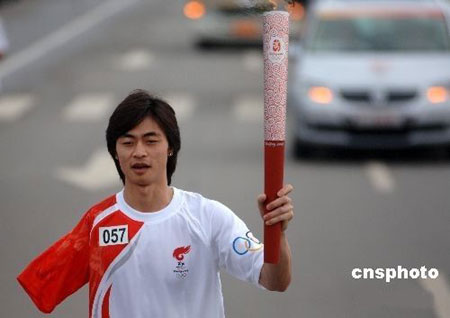 Wang Xiaofu, an amputee swimmer and triple gold medalist at the Athens Games