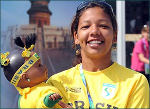 An athlete of Brazil has photos taken with a toy in her arms at the Paralympic Village in Beijing on September 5, 2008. Athletes and delegates from all over the world gathered in Beijing to attend the Beijing 2008 Paralympic Games which will be opened on September 6, 2008.