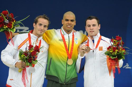 Photos: Andre Brasil of Brazil wins Men's 100m Butterfly S10 gold