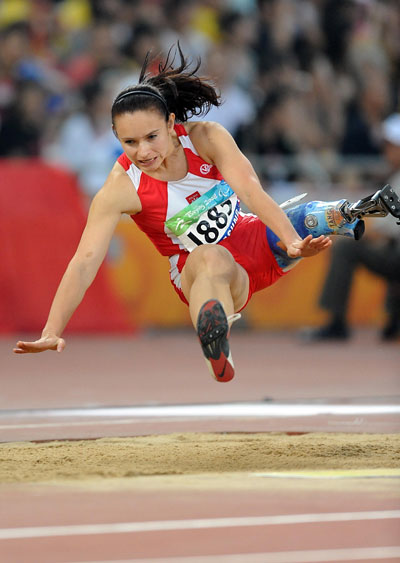 Photos: Christine Wolf of Australia wins Women's Long Jump F42 gold