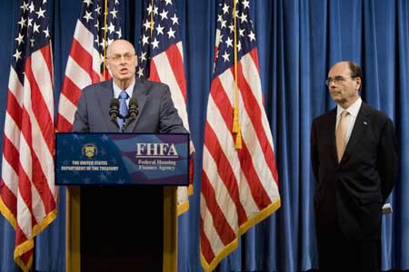 Secretary of the Treasury Henry Paulson (L) and Jim Lockhart, Director of the the new independent regulator, the Federal Finanace Agency (FHFA), announce that the government is taking control of mortgage finance companies Fannie Mae and Freddie Mac during a news conference at the Office of Management Supervision in Washington, DC, Sept. 7, 2008.