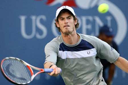 Andy Murray of Britain returns a shot to Rafael Nadal of Spain during the conclusion of their rain delayed semi-final match at the U.S. Open at Flushing Meadows in New York, September 7, 2008.