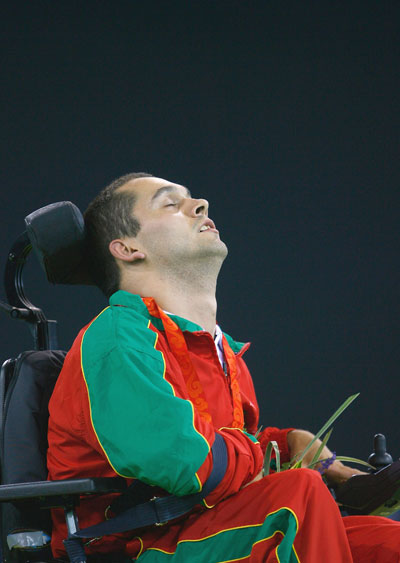 Joao Paulo Fernandes celebrates on the podium at the Fencing Hall of the National Convention Center during day three of the 2008 Paralympic Games on September 9 in Beijing, China. 