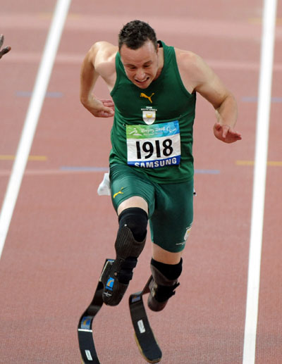 Photos: Oscar Pistorius of South Africa wins Men's 100m - T44 gold