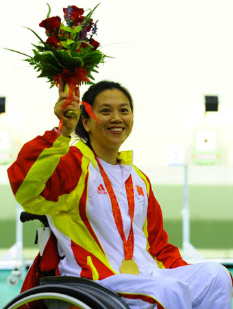 China's Lin Haiyan reacts at the awarding ceremony for the women's P2-10m air pistol SH1 of shooting event during Beijing 2008 Paralympic Games in Beijing, Sept. 8, 2008. Lin Haiyan won the gold with a total score of 467.7.