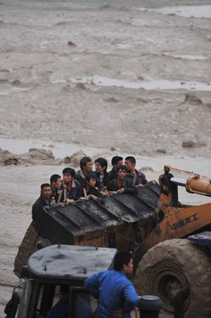 Rescuers are sent to the site of mud-rock flow to carry out work at the Tashan Mine in Xiangfen County under Linfen City of north China's Shanxi Province.