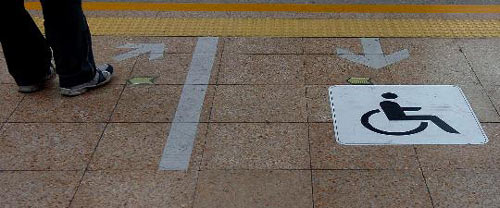 A barrier-free sign in a subway station in Beijing.