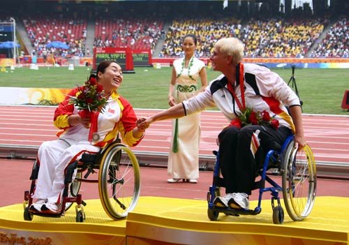 Marianne Buggenhagen (R) greets China's Wang Ting.