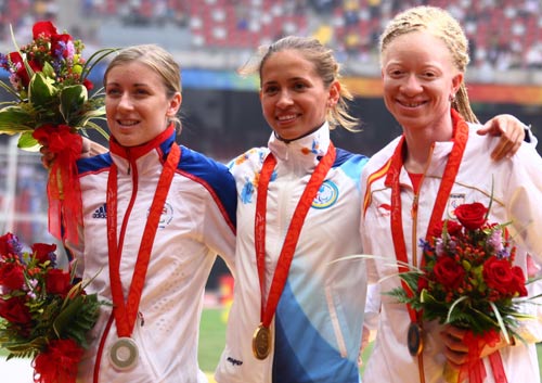  Medalists of the Women's 100m T12 stand on the podium at the National Stadium, also known as the Bird's Nest, in Beijing on September 9, 2008. 