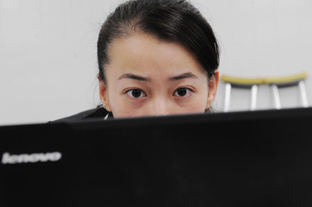 Chinese Paralympian fencer, Jin Jing, looks at a computer before she took part in the torch relay at the opening ceremony of the 2008 Beijing Paralympics Sept. 6, 2008. Jin lost her right leg to a malignant tumor at the age of 18 and is now uses a wheelchair. She moved people by protecting the Olympic torch from attackers in the Paris leg of the torch relay.