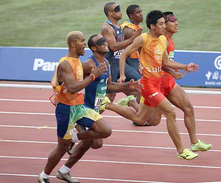 Brazil's Lucas Prado (L2) competes during the first round competition of men's 100m T11 at the National Stadium, also known as the Bird's Nest，at the Beijing 2008 Paralympic Games in Beijing, China, Sept. 8, 2008. 