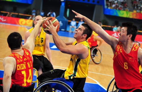 Tristan Knowles of Australia goes for a shot. Australia dominated from start to finish to cruise past China 79-44 for their third win of the Beijing Paralympic Wheelchair Basketball preliminaries on Tuesday at the National Indoor Stadium.