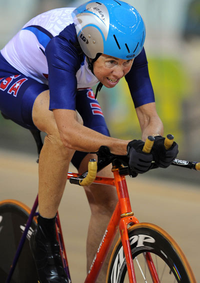 American Barbara Buchan on her way to winning the women's individual pursuit (LC3-4/CP3) on September 10, 2008. The 53-year-old is the oldest cycling champion in the Beijing Games. [Xinhua]