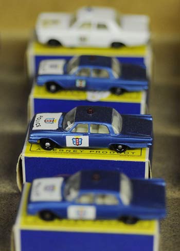 American matchbox police cars valued at 1,000 pounds ($1,760) each are seen at Vectis in Thornaby, northern England, September 10, 2008. 