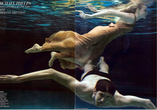 Michael Phelps swims under water with model Caroline Trentini.
