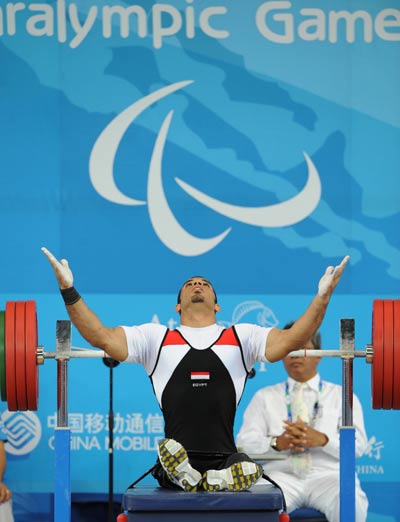 Sherif Othman Othman of Egypt prays before lifting. He lifted 202.5kg to break the world record and claim the title of the Men's Powerlifting 56kg at the Beijing 2008 Paralympic Games in Beijing on September 11, 2008.