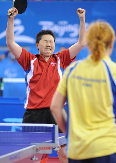 Thu Kamkasomphou (L) of France celebrates. She beat Josefin Abrahamsson of Sweden 3-0 to claim the title of the Table Tennis Women's Individual Class 8 at the Beijing 2008 Paralympic Games on September 11, 2008.