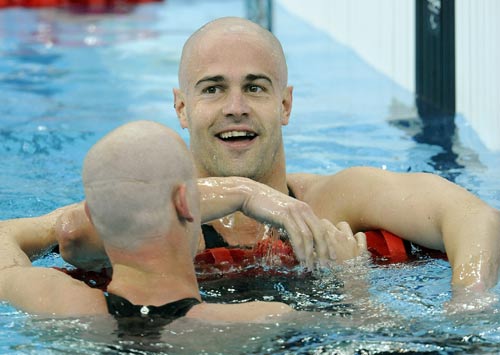 David Roberts (R) of Great Britain receives congratulations. He won the Men's 400m Freestyle S7 gold medal, with a time of four minutes and 52.35 seconds, at the National Aquatics Center in Beijing on September 11, 2008.