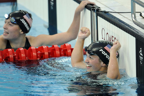 Erin Popovich (R) of the United States celebrates. She won the Women's 400m Freestyle S7 gold medal, with a time of five minutes and 17.41 seconds, at the National Aquatics Center in Beijing on September 11, 2008.