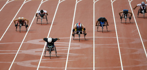 Hong Suk-man of the Republic of Korea (front) competes in the final. He won the gold medal of the Men's 400m T53 with 47.67 seconds to set a new world record at the National Stadium,also known as the Bird's Nest,during the Beijing 2008 Paralympic Games on September 11, 2008. 