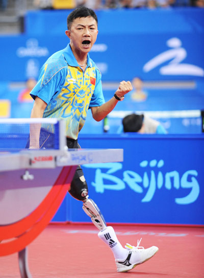 Chen Gang of China celebrates. He beat Piotr Grudzien of Poland 3-1 to claim the title of the Men's Table Tennis Individual Class 8 at the Beijing 2008 Paralympic Games on September 11, 2008.