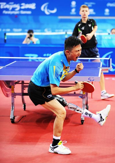 Chen Gang of China celebrates. He beat Piotr Grudzien of Poland 3-1 to claim the title of the Men's Table Tennis Individual Class 8 at the Beijing 2008 Paralympic Games on September 11, 2008. 