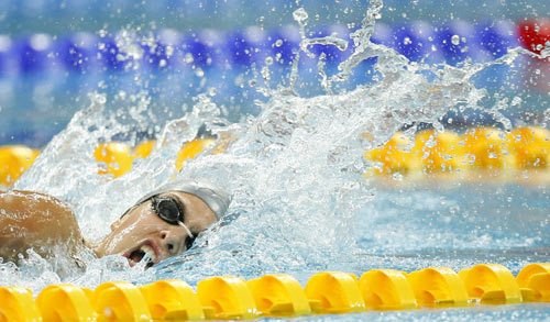 Russia's Oxana Savchenko claimed title of S12 and broke the world record.[Xinhua]