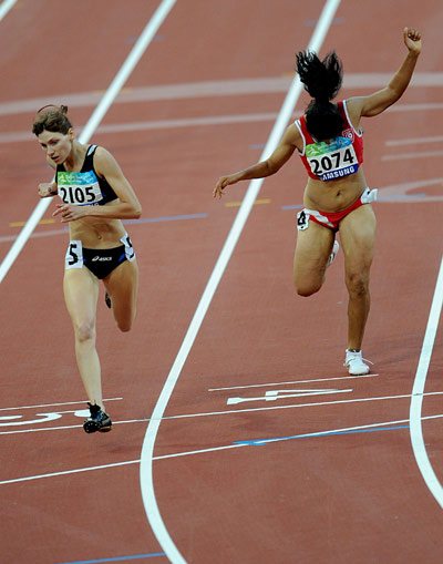 Inna Dyachenko of Ukraine (L) crosses the finish line. She finished the Women's 200m T38 final in 27.81 seconds and set a new world record to win the gold medal at the National Stadium, also known as the Bird's Nest,during the Beijing 2008 Paralympic Games on September 12, 2008.