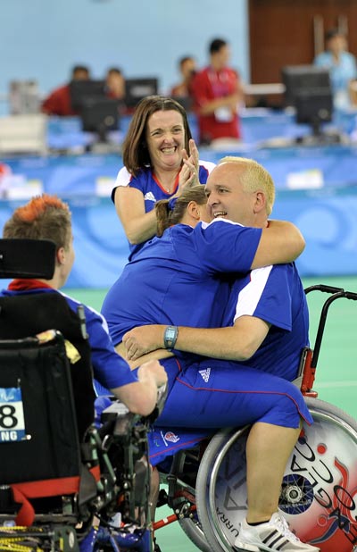 Britain's Nigel Murray (R) celebrates with his relatives after the final. Great Britain beat Portugal 8-4 and claimed the title of the Mixed Team BC1-2 of the Beijing 2008 Paralympic Games Boccia event on September 12, 2008. 