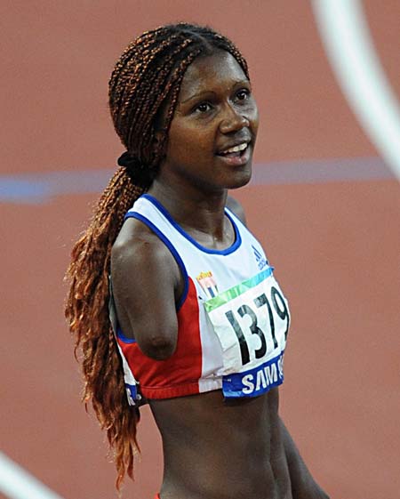 Yunidis Castillo of Cuba reacts after the women&apos;s 200m-T46 final at the National Stadium，also known as the Bird&apos;s Nest，during the Beijing 2008 Paralympic Games in Beijing, China, Sept. 12, 2008. Castillo set a new world record with 24.72 secs and won the gold. (Xinhua/Tao Ming) 