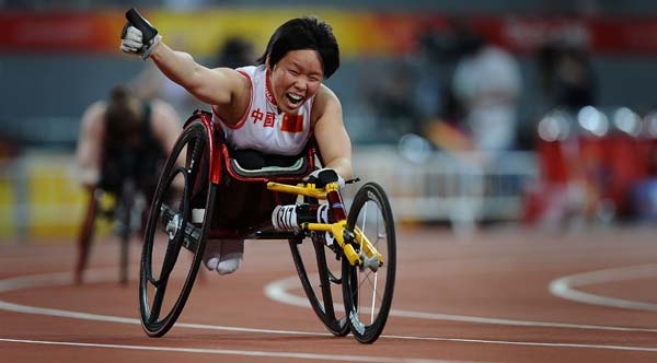 Huang Lisha of China celebrates after the women&apos;s 100m-T53 final at the National Stadium，also known as the Bird&apos;s Nest，during the Beijing 2008 Paralympic Games in Beijing, China, Sept. 12, 2008. Huang won the title with 16.22 secs. (Xinhua/Guo Dayue) 