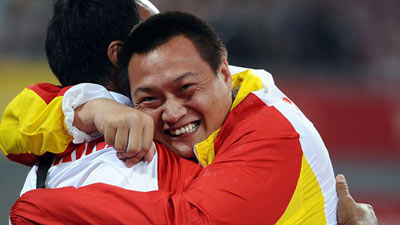 Xia Dong celebrates with his coach.