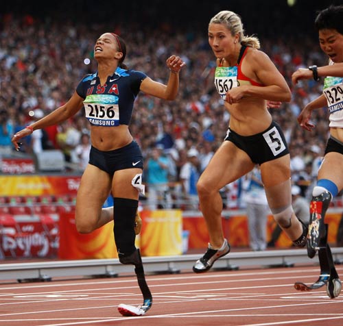 Photos: April Holmes of the United States wins Women's 100m - T44 gold