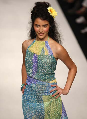 A model presents a creation of designer Caroline Charles' Spring and Summer 2009 collections during the opening of the London Fashion Week in London Sept. 14, 2008.