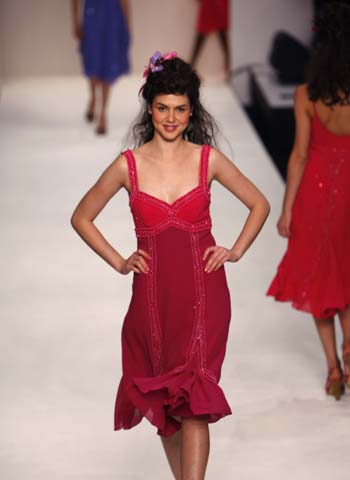 A model presents a creation of designer Caroline Charles' Spring and Summer 2009 collections during the opening of the London Fashion Week in London Sept. 14, 2008.