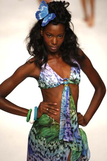 A model presents a creation of designer Caroline Charles' Spring and Summer 2009 collections during the opening of the London Fashion Week in London Sept. 14, 2008.