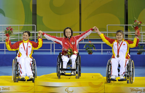 Medalists pose on the podium. [Xinhua]