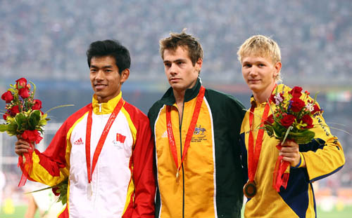 Medalists pose on the podium. [Xinhua]