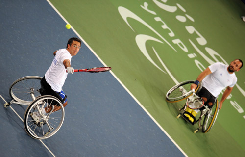 Michael Jeremiasz and Stephane Houdet of France compete. They beat Stefan Olsson and Peter Wikstrom of Switzerland 2-0 to win the gold medal of the Men's Doubles Open of the Wheelchair Tennis event during the Beijing 2008 Paralympic Games on September 15, 2008.